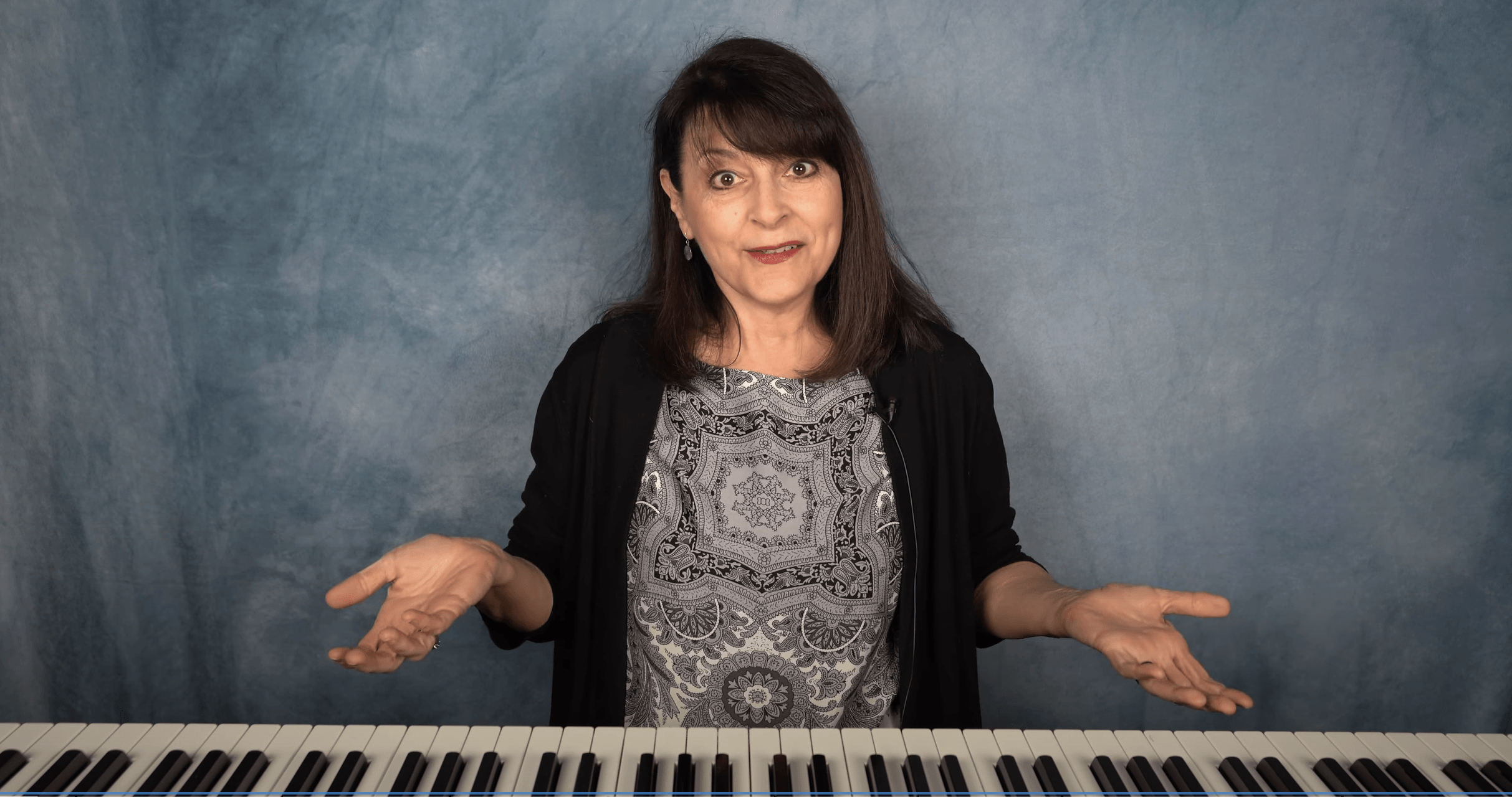 Miss Suzanna teaching beginner piano